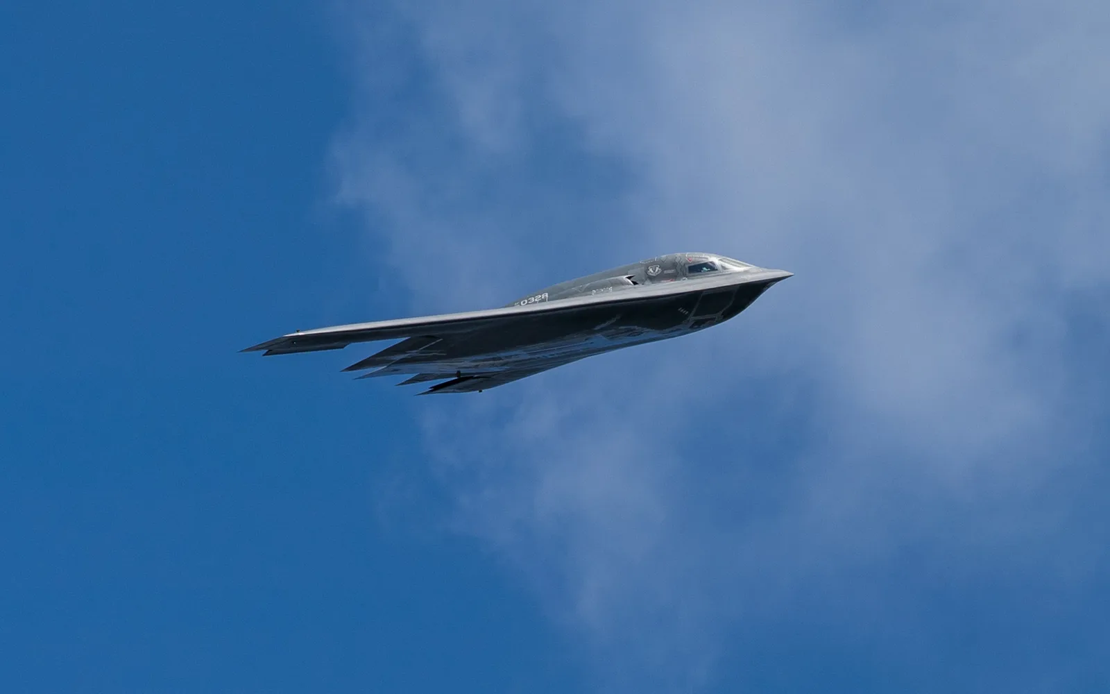 B-2 Spirit stealth bomber in flight, captured during Big Country AirFest 2019, showing advanced military aerospace technology in the clear desert sky